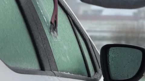 Frozen car windows. Clean off the ice Stock Footage 143583215