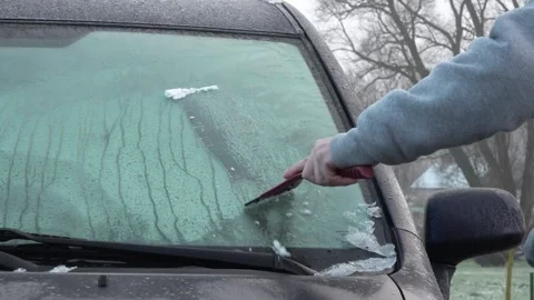 Frozen car windows. Clean off the ice Stock Footage 143583216
