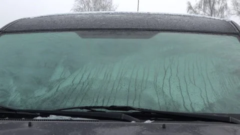 Frozen car windows. Clean off the ice Stock Footage 143583220