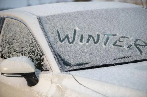 Frozen Car Windshield With Winter Text Stock Photos