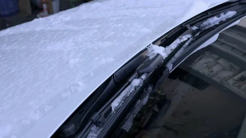 Frozen car windshield wiper blade covered in thick winter snow and ice Stock-Footage 329632934