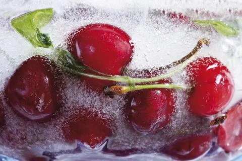 Frozen cherries close up Stock Photos