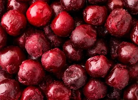 Frozen cherries closeup, background. The view of top. Stock Photos