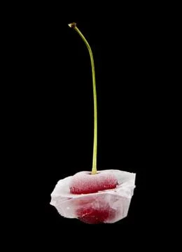 Frozen cherry on a black background closeup Stock Photos