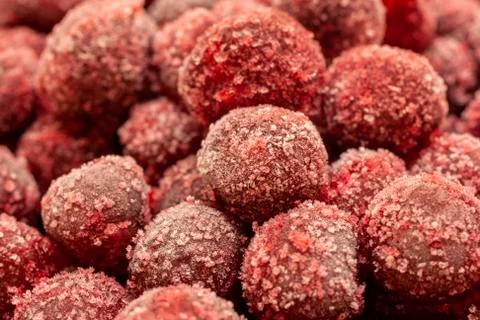 Frozen cherry fruit close up. Cherry in ice crystals. Stock Photos