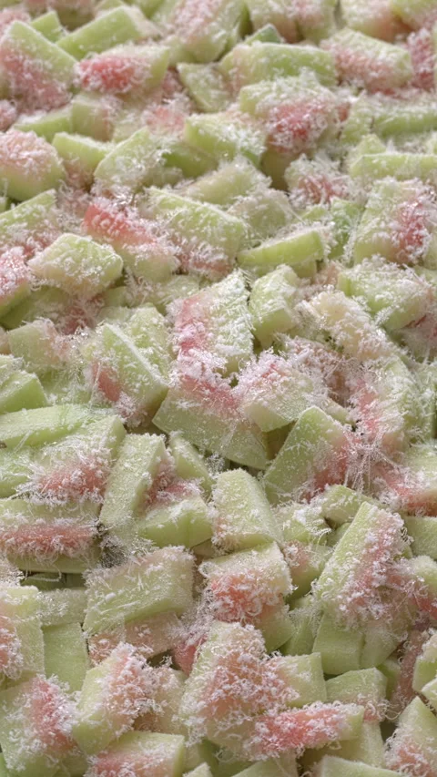 Frozen chunks of watermelon rind. Background texture. Vertical video. Stock Footage 311674595