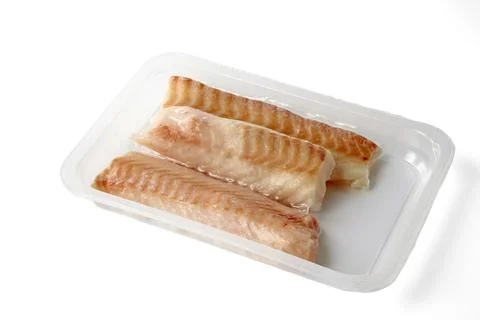 Frozen cod fillet in vacuum packaging isolated on white background angle view Stock Photos