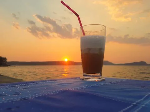 Frozen coffee against the sunset. Stock Photos