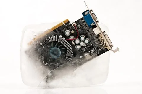 Frozen computer part in ice cube on winter time Stock Photos