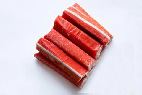 Frozen crab sticks on a white background Stock Photos