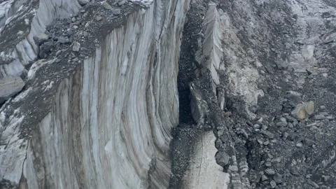 A frozen crack of glacier surface. A torn ice texture of the icefall relief and Stock Footage 169749164