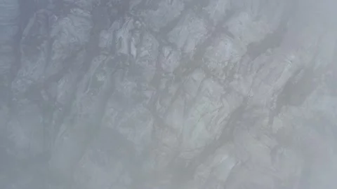 A frozen crack of glacier surface. A torn ice texture of the icefall relief and Stock Footage 169749656