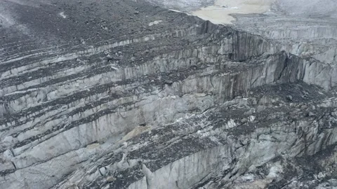 A frozen crack of glacier surface. A torn ice texture of the icefall relief and Stock Footage 169749849