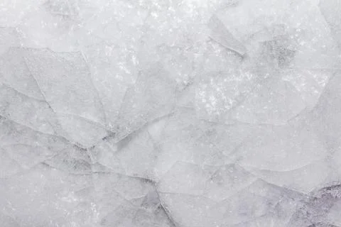Frozen cracked ice texture background. Stock Photos
