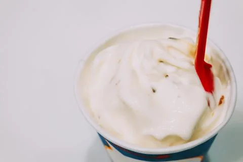 Frozen custards or soft ice creams in disposable blank paper cup Stock Photos