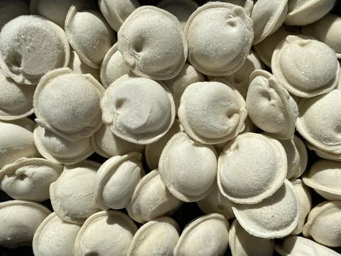 Frozen dumplings close-up in the kitchen Stock Photos