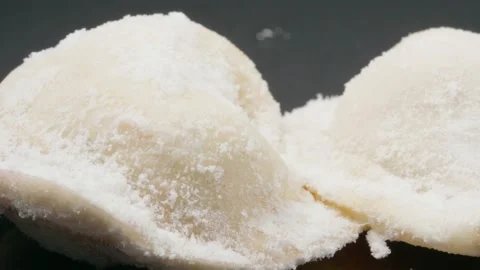 Frozen dumplings in flour. Macro. Dark background. Stock Footage 140474285