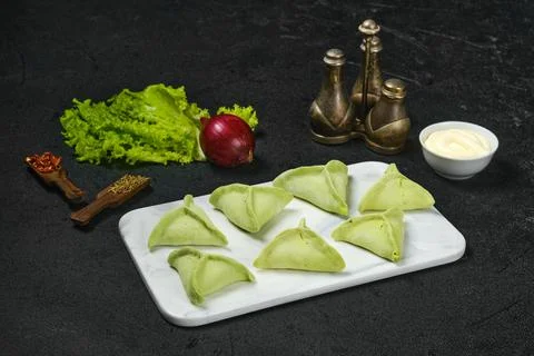 Frozen dumplings with spinach Stock Photos