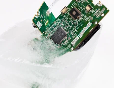 Frozen electonics board for pc in ice Stock Photos