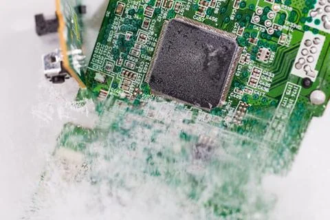 Frozen electonics board for pc in ice Stock Photos