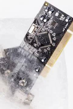 Frozen electonics board for pc in ice Stock Photos