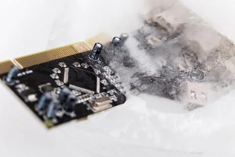 Frozen electonics board for pc in ice Stock Photos