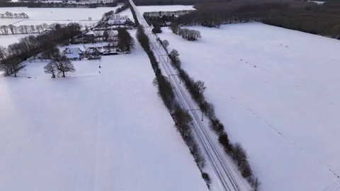 Frozen Fields And Distant Farm, Elevated Perspective Over Icy Farmland With Stock Footage 327051997