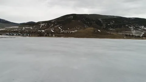 Frozen Flight: Drone Crashes and Strands on Icy Lake in Winter’s Grip Stock Footage 288495316