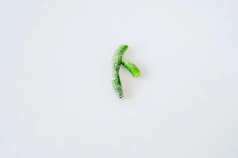 Frozen fresh beans on a light background. Green string beans. Green beans wit Stock Photos