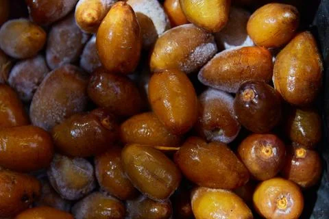 Frozen fresh dates texture pattern. Flat lay top veiw healthy snack. Fruits in Stock Photos