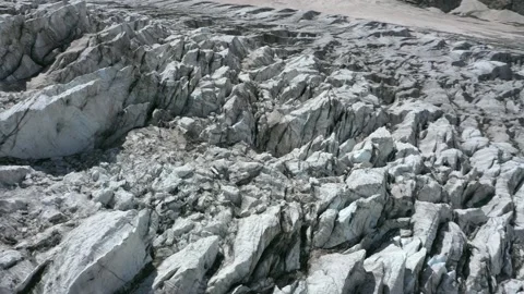 A frozen glacier surface. A torn ice texture of the icefall relief Stock Footage 169745702