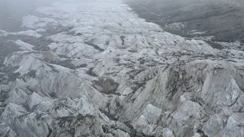 A frozen glacier surface. A torn ice texture of the icefall relief and ice lumps Stock Footage 169749621