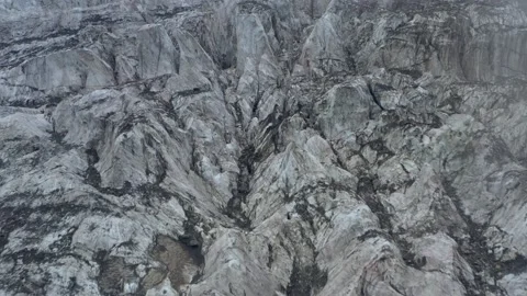 A frozen glacier surface. A torn ice texture of the icefall relief and ice lumps Stock Footage 169750098