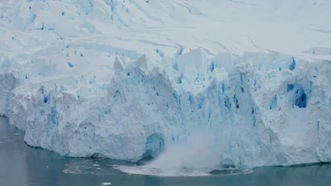 Frozen glacier wall collapses into polar sea Stock Footage 339112071