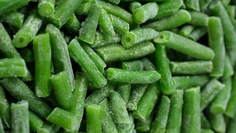 Frozen green beans close up, rotation. Healthy vegan food concept Video stock 260392999