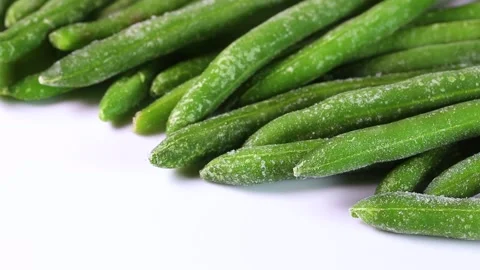 Frozen green beans on white background, rotating Stock Footage 322039963