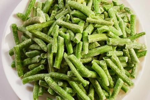 Frozen green string beans covered in frost Stock Photos
