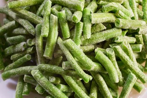 Frozen green string beans covered in frost Stock Photos