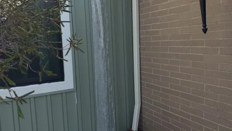 A Frozen Gutter on Residential Home Stock Footage 328272185
