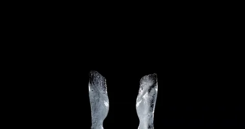 Frozen hands on a black background 库存影片 72029212