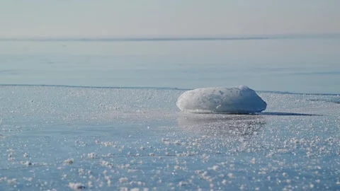 Frozen Ice Chunk On Winter Sea Surface - Calm Open Water Beyond The Horizon Stock Footage 346093991