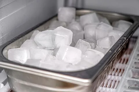 Frozen ice cubes in the freezer. Stock Photos