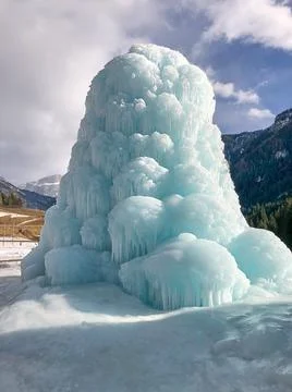 Frozen ice formation under cloudy sky Stock Photos