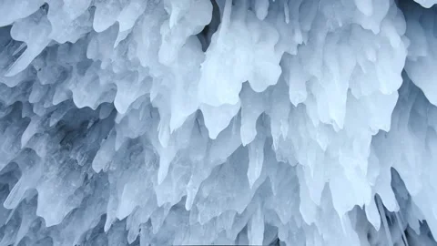 Frozen ice icicles on ceiling in the cave. icy frozen splashes, winter pattern. Stock Footage 221049901