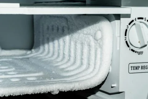 Frozen ice inside the refrigerator Stock Photos