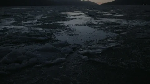 Frozen ice on the river surface flowing with the water Stock Footage 104525763