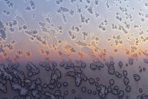 Frozen ice on the window pattern. Close-up. Frozen ice on the wall pattern Stock Photos