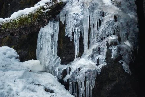 Frozen icicles on rock Stock Photos
