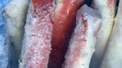 Frozen king crab claws in the freezer for sale in the supermarket. Delicatessen Stock Footage 300055023