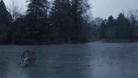 Frozen lake with an abandonned table Stockbeeldmateriaal 71797517